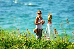 Female Surveyor works waterside graphic.